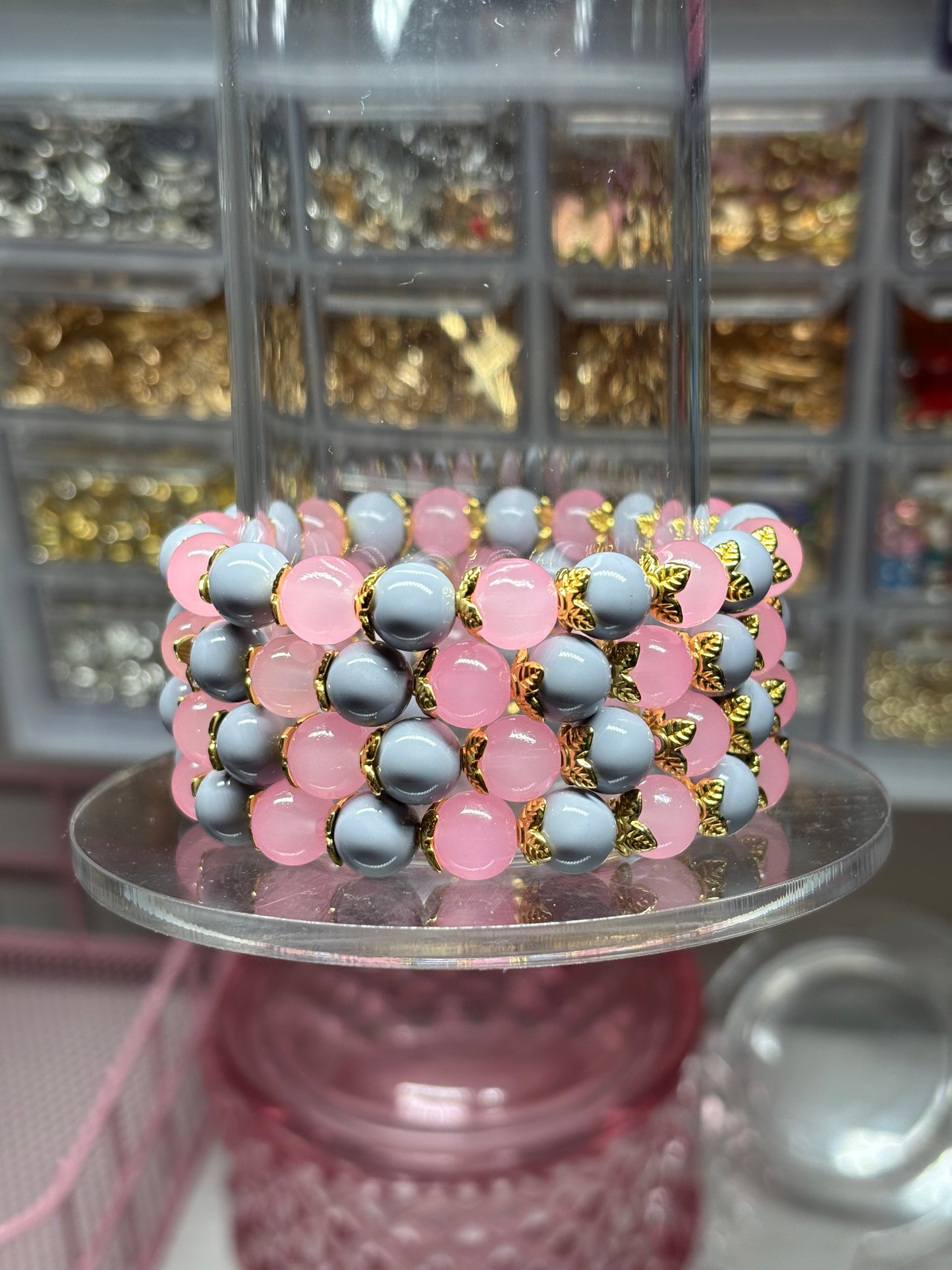 Light pink and Light gray bead bracelet with gold spacers