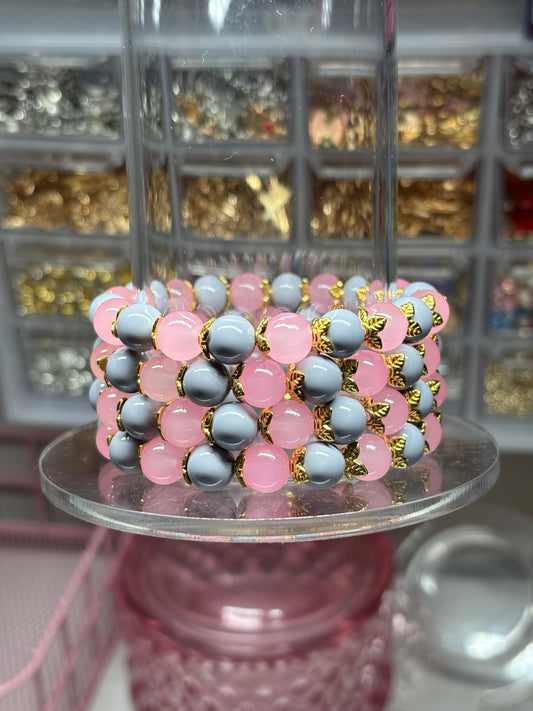 Light pink and Light gray bead bracelet with gold spacers